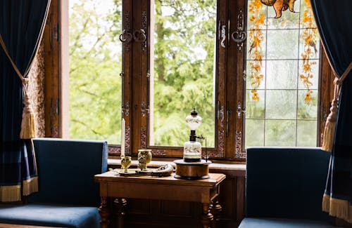 Vintage Table and Curtains by Windows