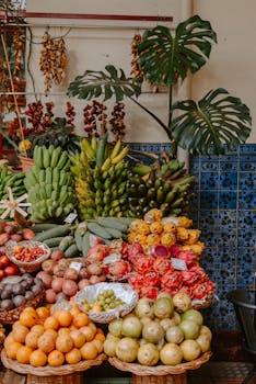 Colorful assortment of exotic fruits at an outdoor market stall, showcasing tropical abundance.