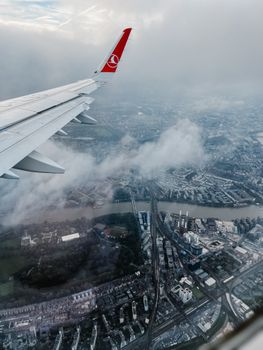 Stunning aerial view of urban landscape from airplane window during flight.