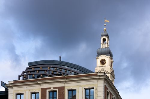 Free A detailed view of Riga's historic city hall clock tower against a dramatic sky. Stock Photo