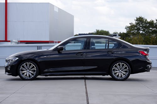 Black BMW 320D on Pavement in Side View