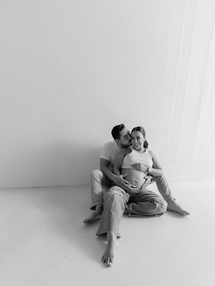 Couple Expecting A Baby Posing In Black And White