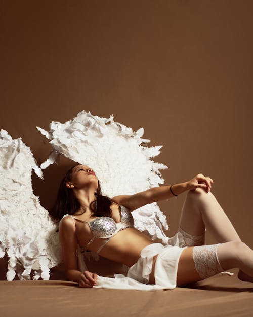 Woman Sitting in Lingerie and Angel Wings