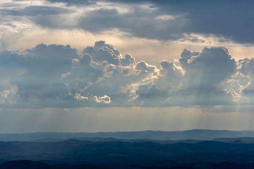 Free Stunning aerial view of dramatic clouds and sunbeams over Belo Horizonte's landscape. Stock Photo