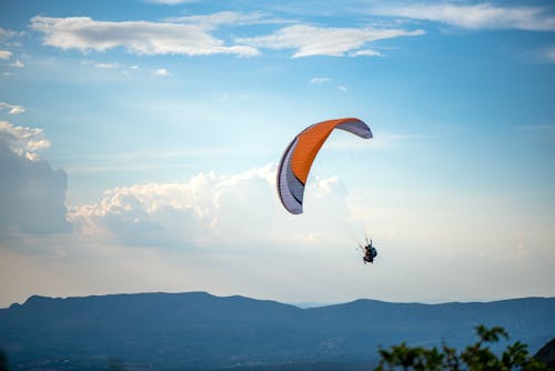 Couple Parachuting in Sky