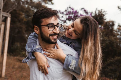 A Couple Hugging and Smiling 