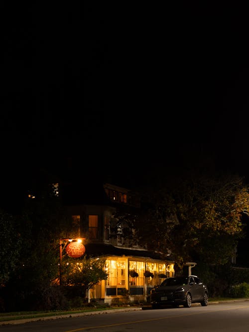 Illuminated Building in City at Night 