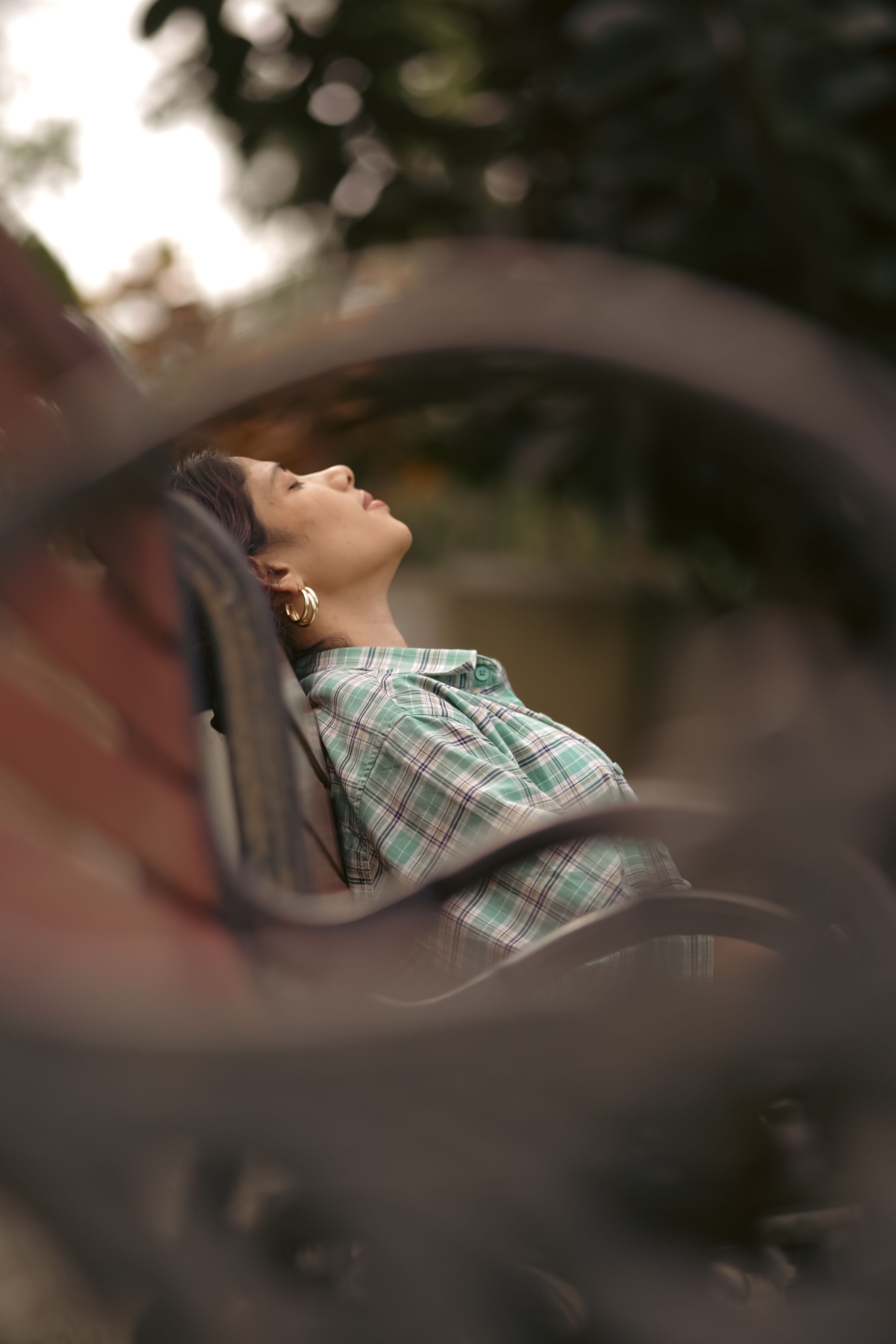 Woman in Shirt Sitting on Bench with Eyes Closed · Free Stock Photo