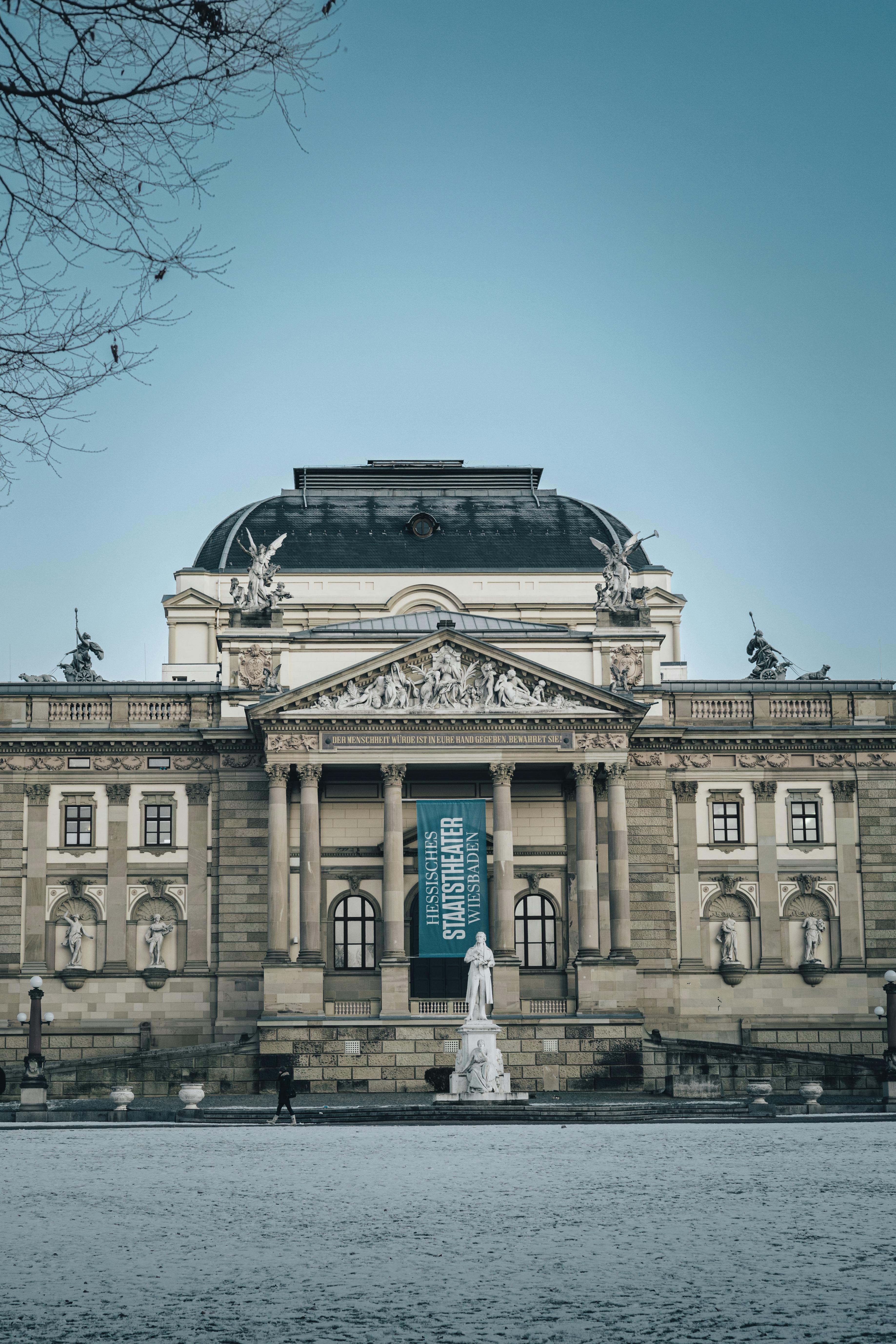 Free Front view of the Wiesbaden State Theatre showing its ornate facade during winter. Stock Photo
