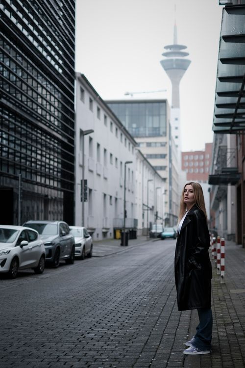 Woman in Black Coat Standing on Street · Free Stock Photo