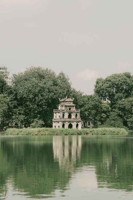 Scenic view of Turtle Tower reflecting in Hoan Kiem Lake, Hanoi.