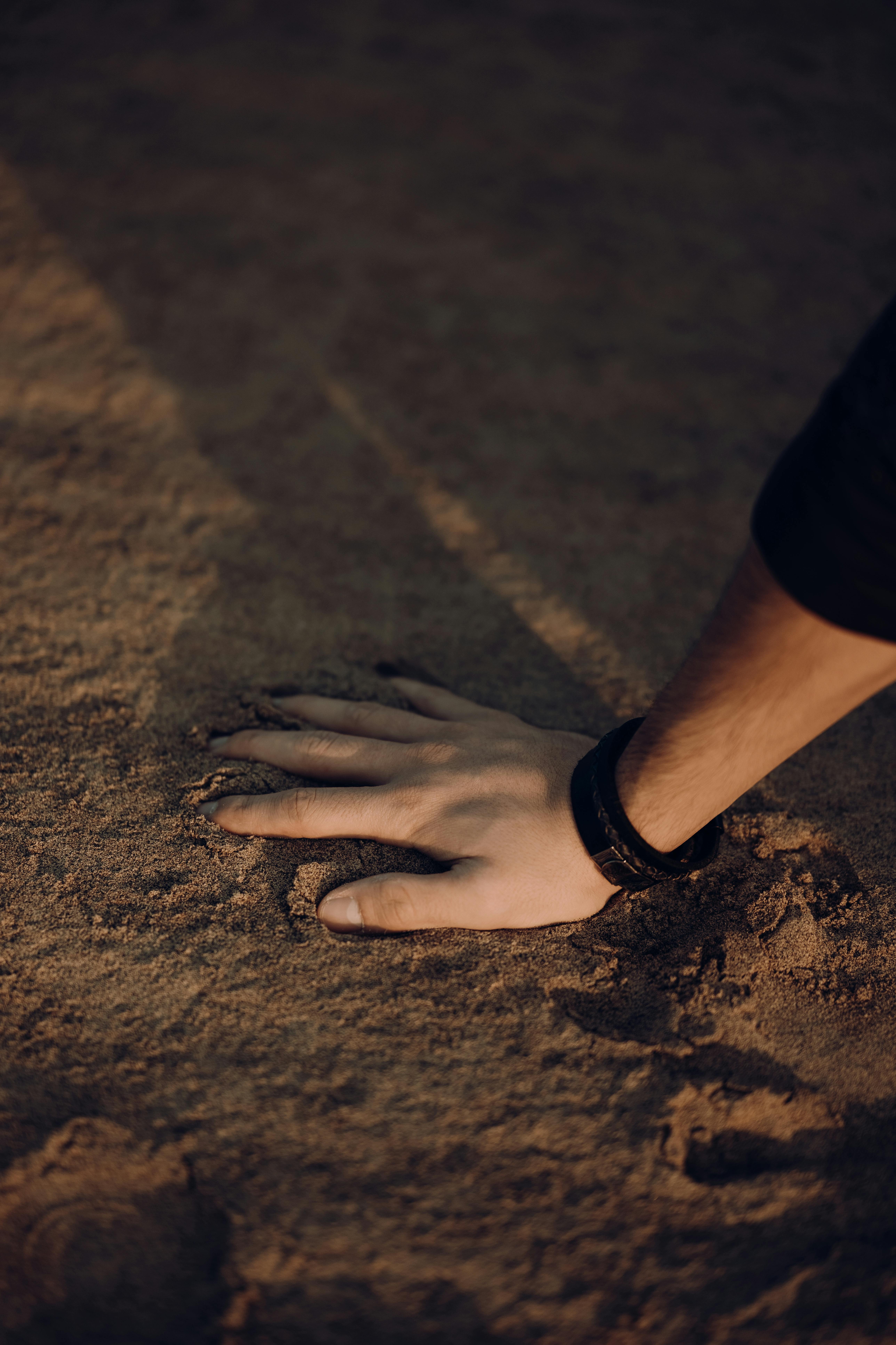 Man Hand on Ground · Free Stock Photo