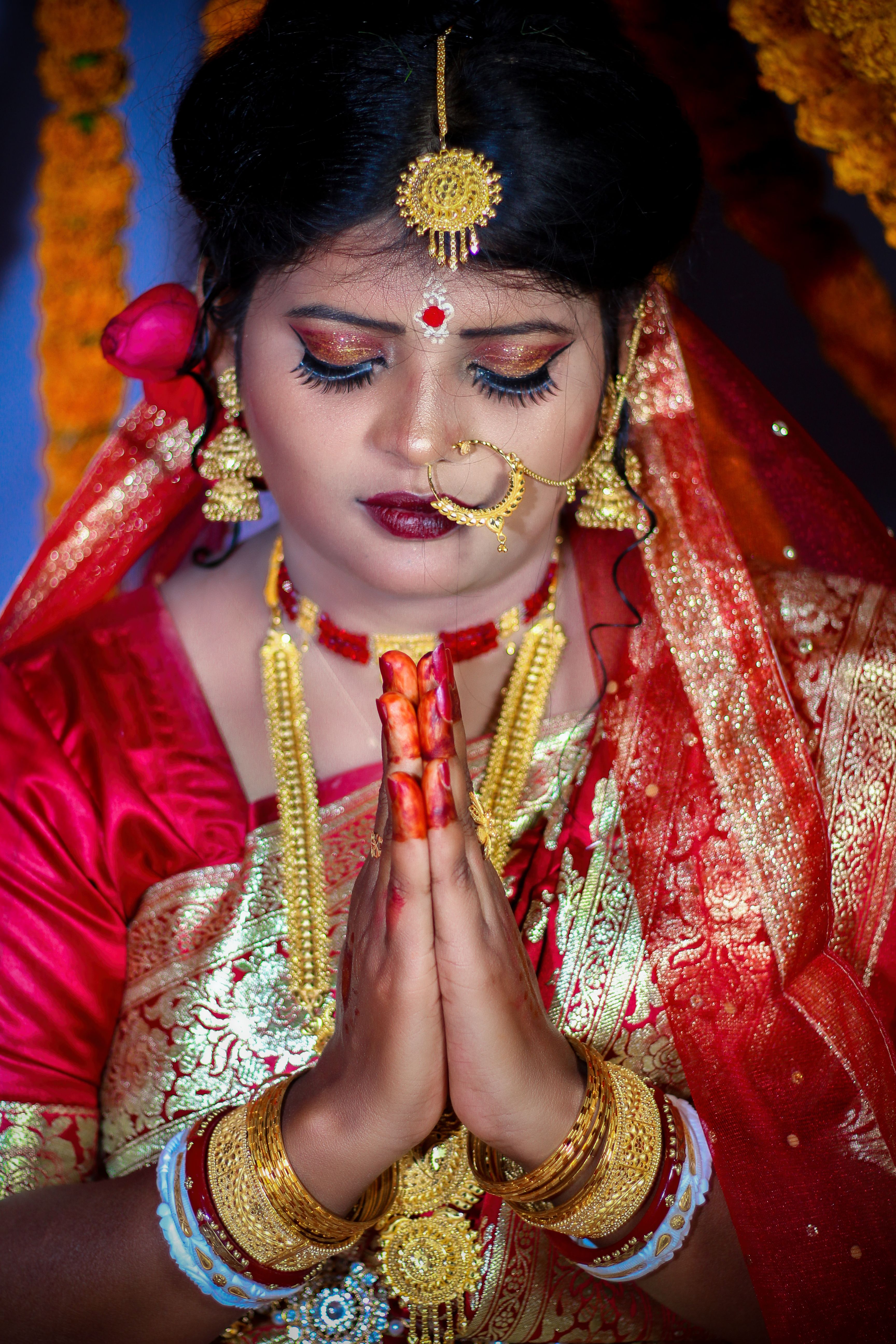 Praying Bride in Traditional Indian Wedding Attire · Free Stock Photo
