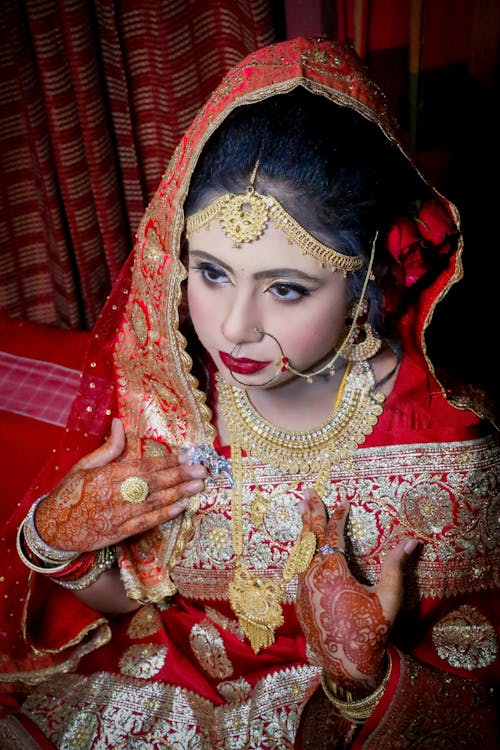 Woman in Traditional Clothing with Golden Jewelry