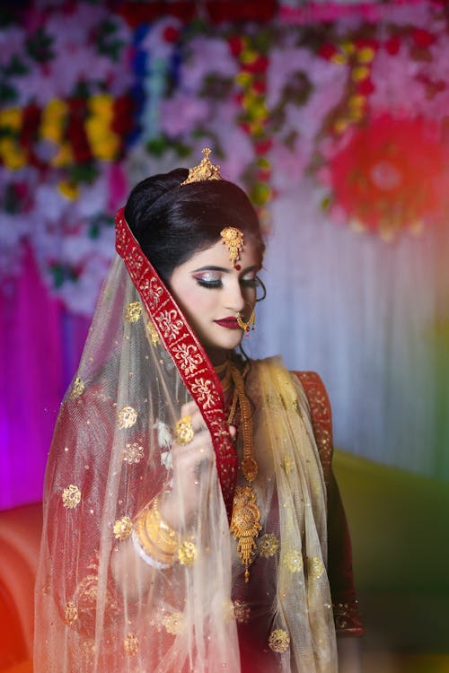 Woman in Traditional Clothing and Veil