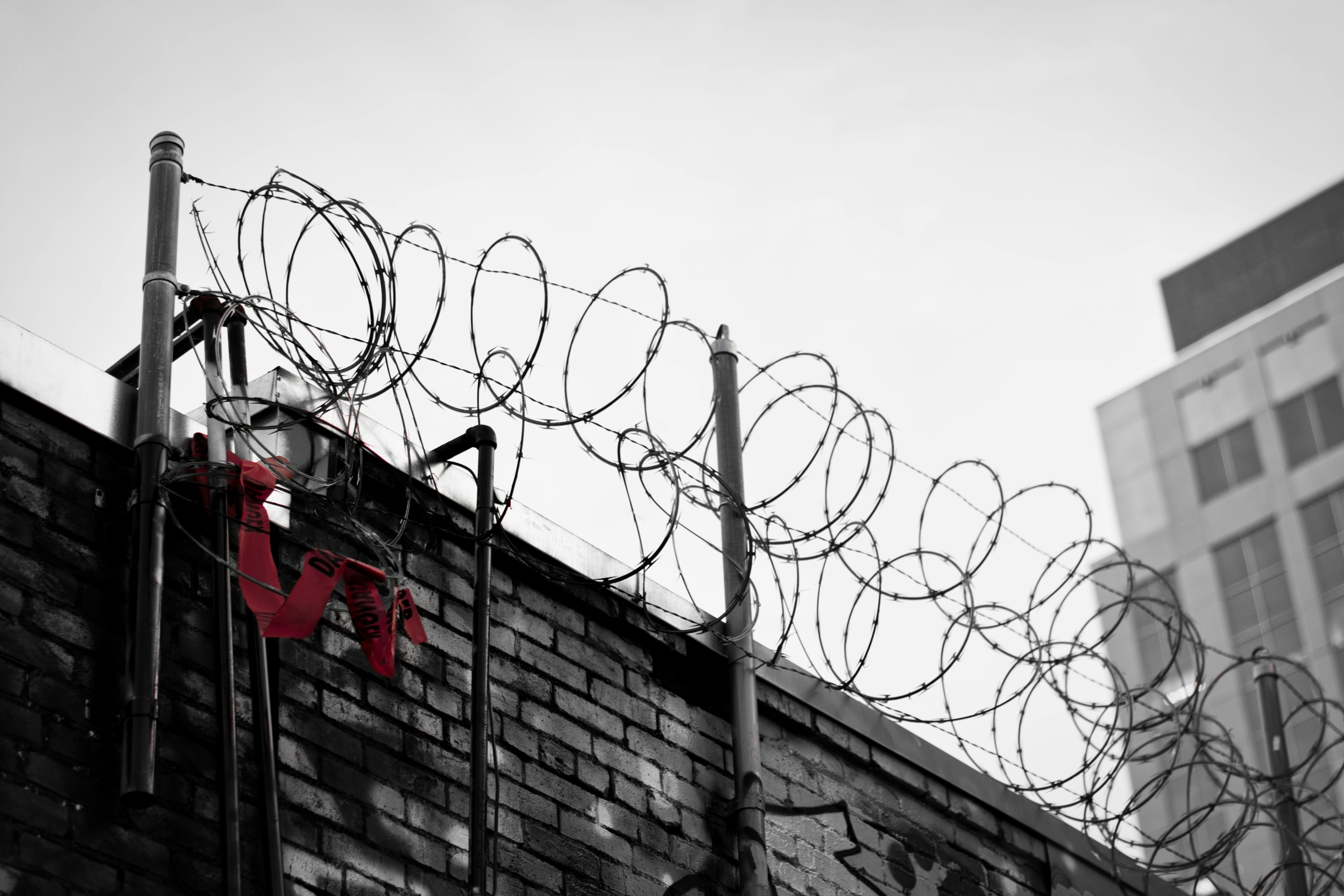 Free stock photo of barbed wire, building, fence