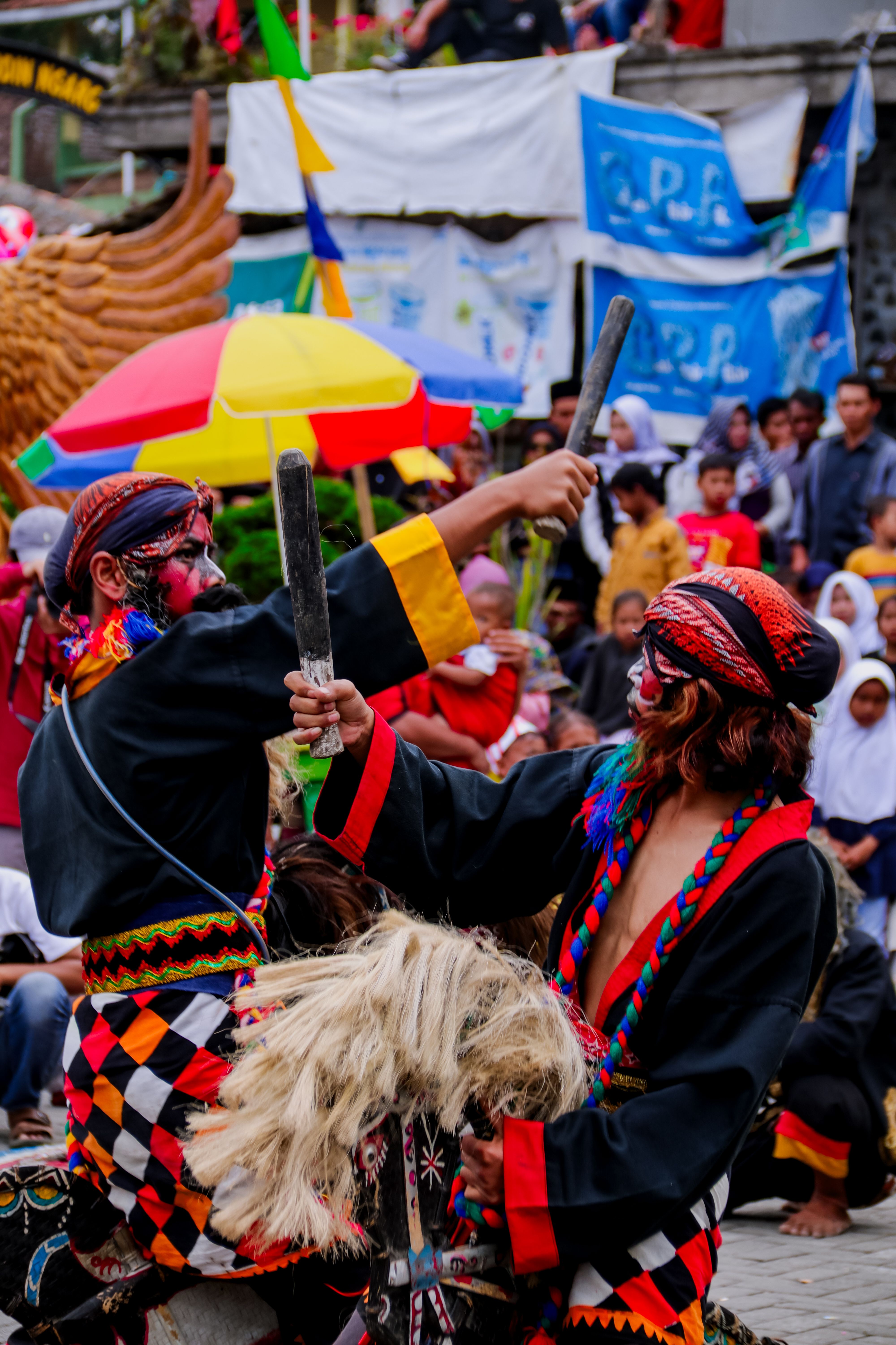 Vibrant street parade with traditional costumes and performances in a lively urban setting.