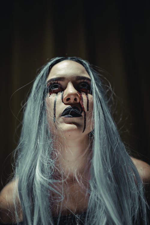 Young Woman with Gray Hair and Bloody Tears