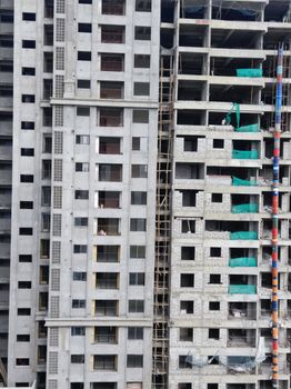 Aerial view of a high-rise residential building under construction in Chennai, India.