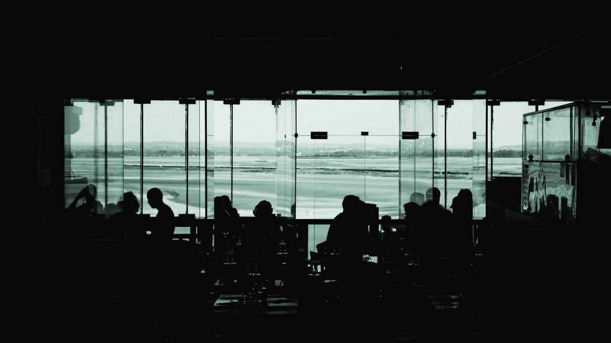 Travellers inside a modern airport terminal