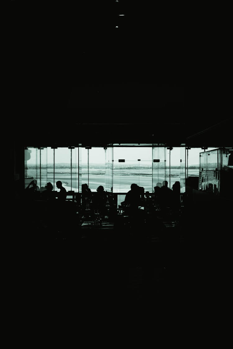 Silhouette Of People In Office In Darkness