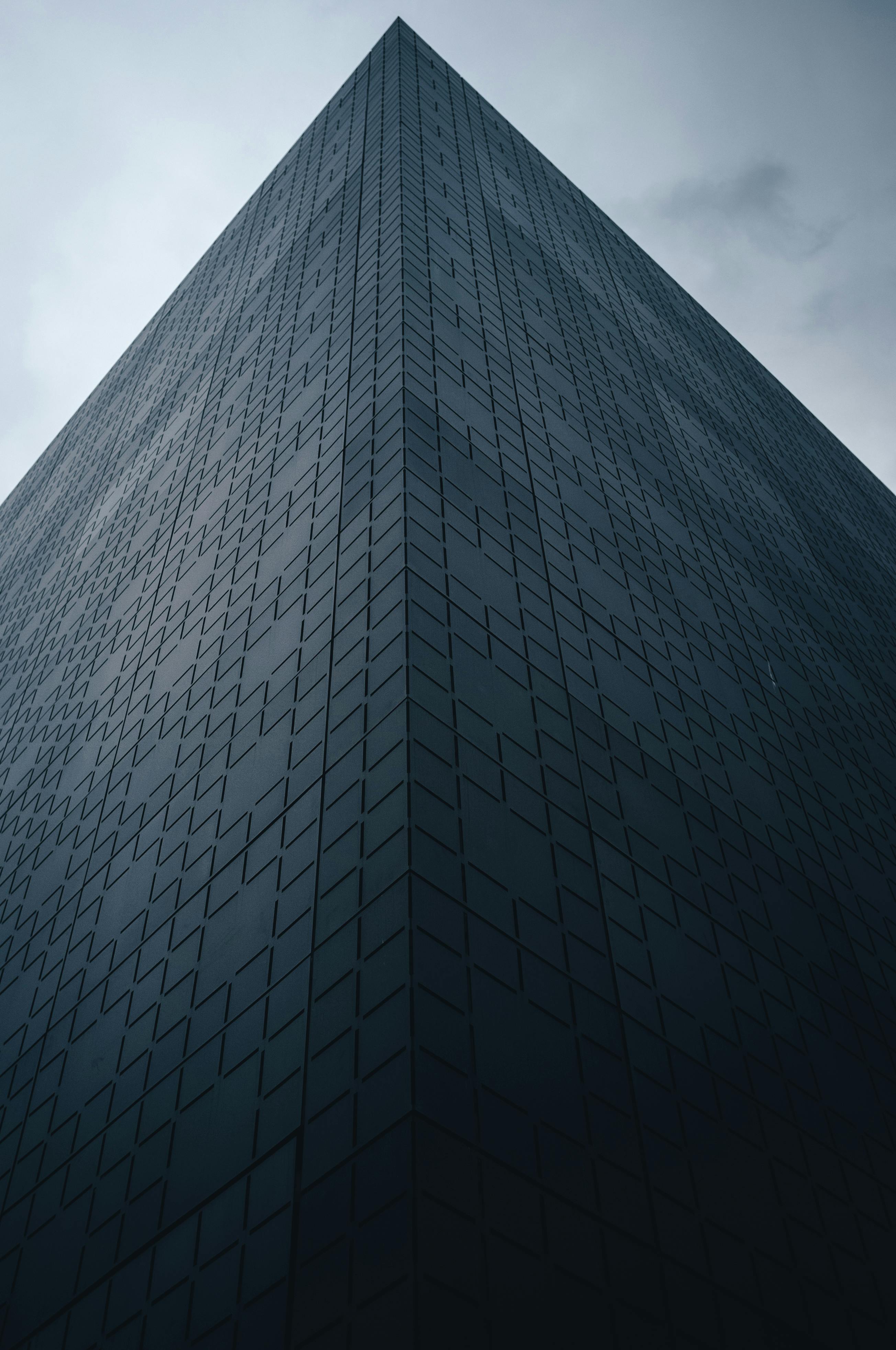 Low angle view of a modern office building in Luxembourg City with geometric facade.