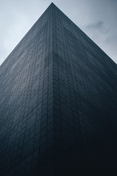 Low angle view of a modern office building in Luxembourg City with geometric facade.