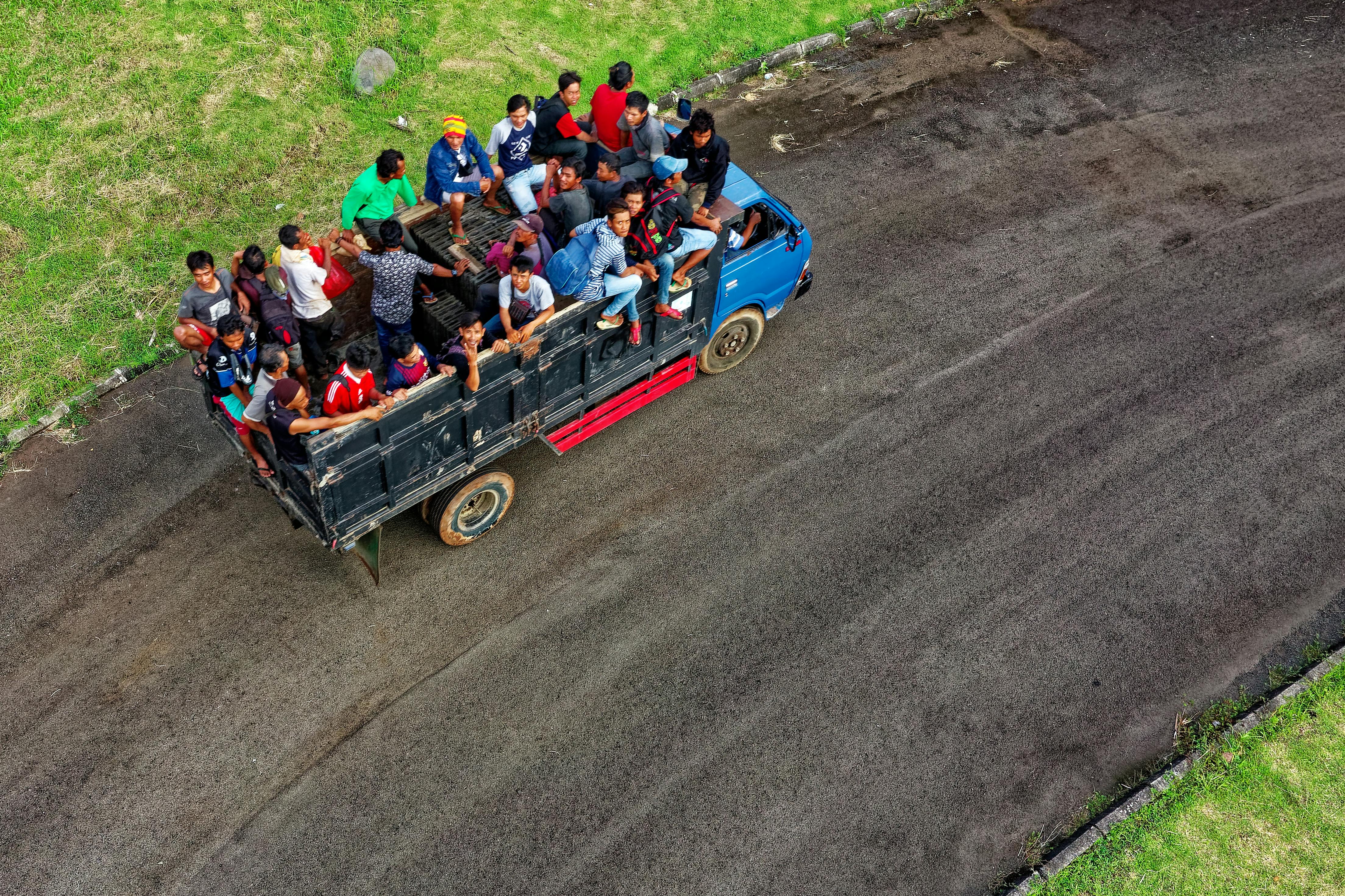 aerial photo of people riding in truck