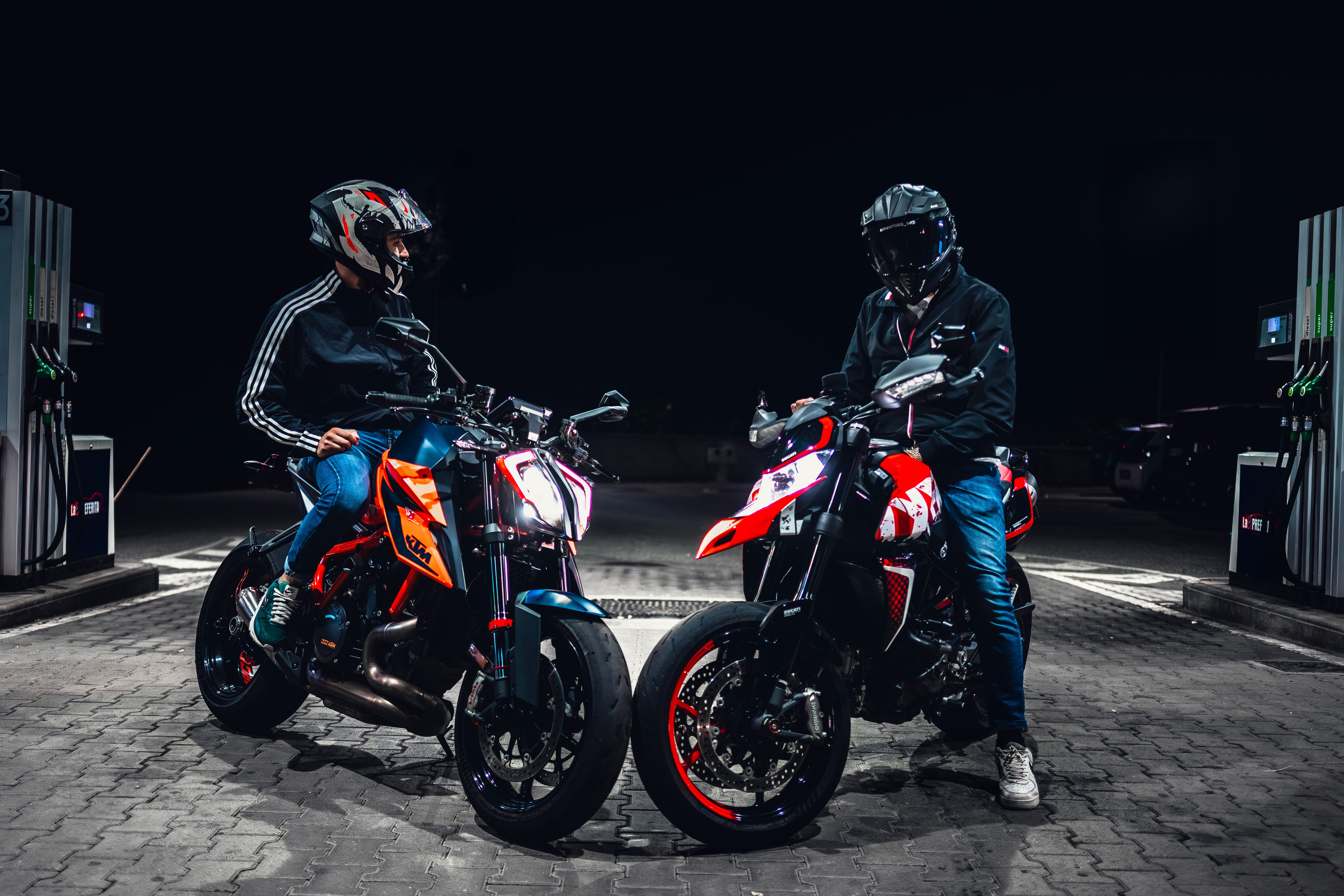 Two Men Sitting on Motorcycles at Night · Free Stock Photo