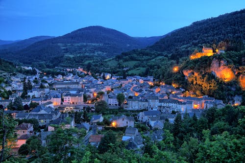 Town in Valley with Hills around in Evening