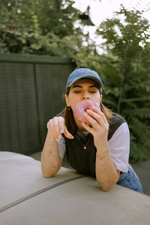 Woman Eating Donut