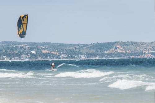 Kitesurfing on Waves on Sea Coast