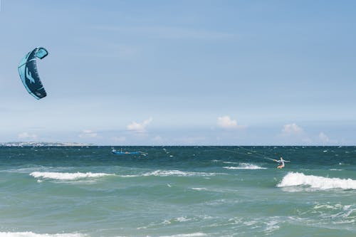 Woman Kitesurfing on Sea Shore