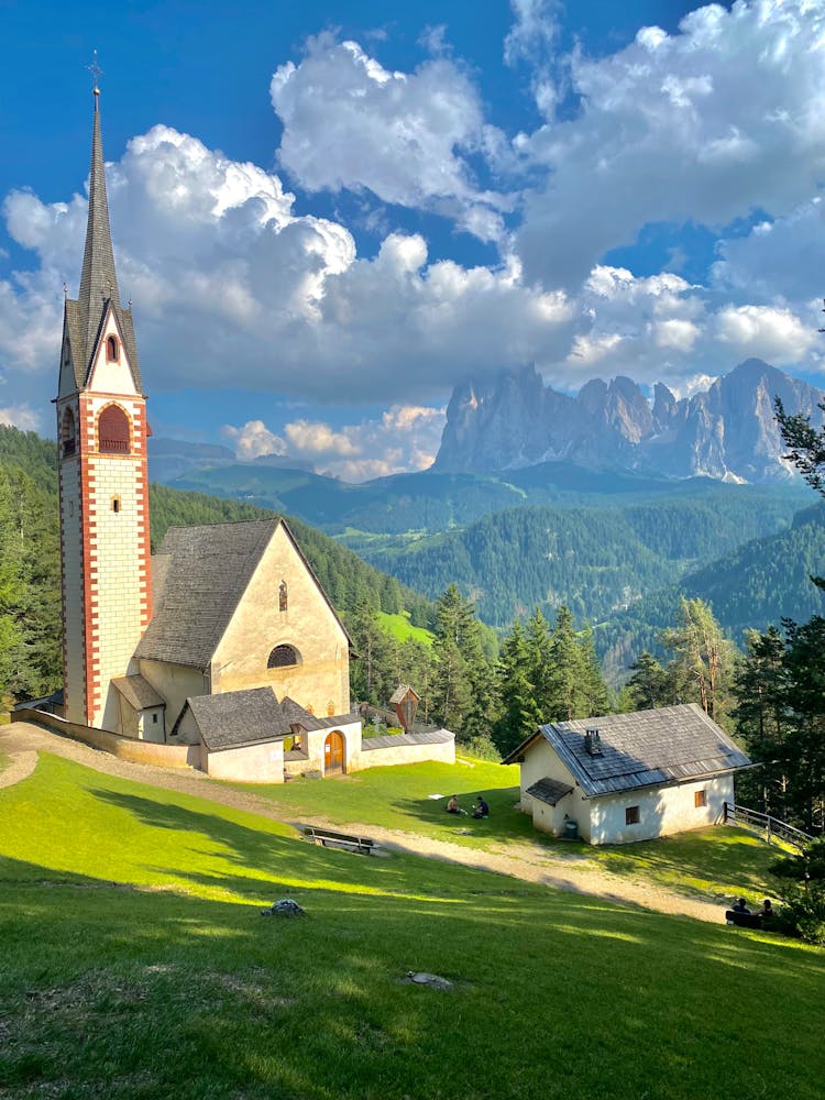 Church In Village In Mountains In Italy