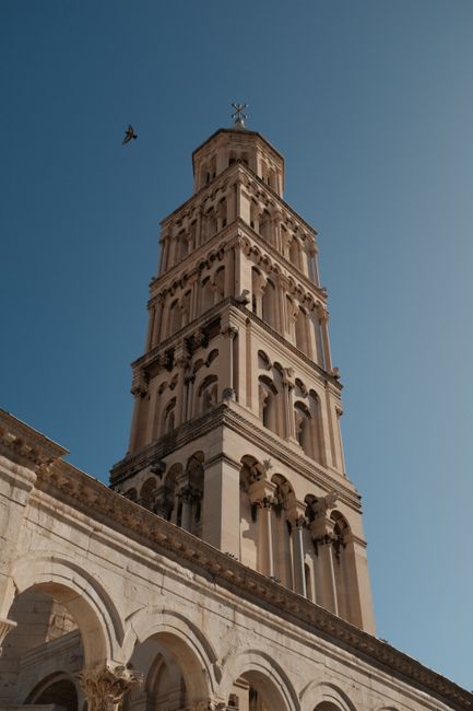 Vertical shot of the Cathedral of Saint Domnius tower in Split, Croatia, showcasing Romanesque architecture.