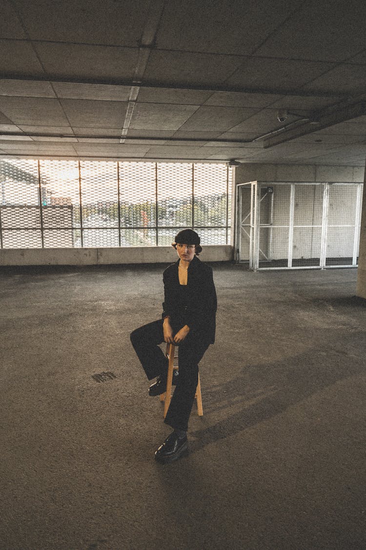 Woman Wearing Black Suit On A Parking Lot 