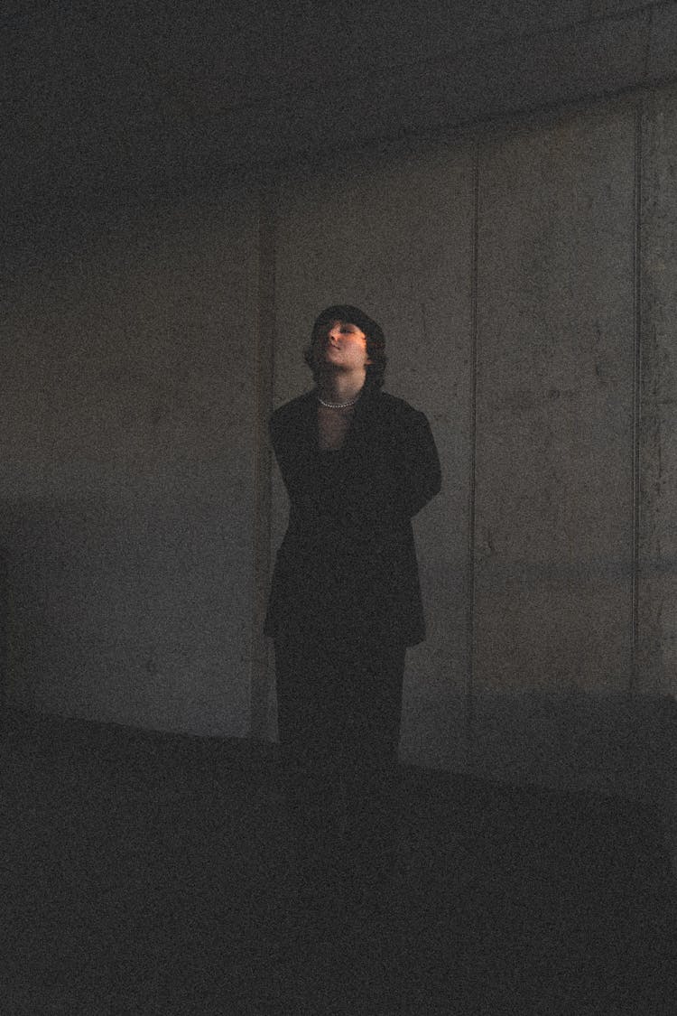 Woman Wearing Black Coat In A Tunnel