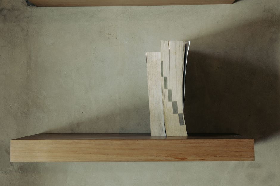 5 Simple Ways to Create a Stylish Floating Shelf for Your Minimalist Home Setup Modern living room with white walls, wooden floating shelf, and clean lines