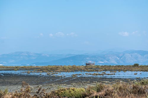 Fotos de stock gratuitas de cerros, charco, llanuras