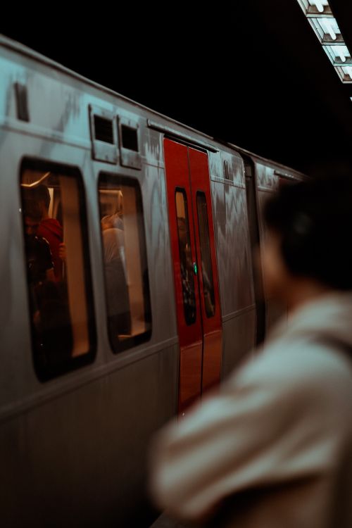 Free Passengers waiting and boarding the train at Ankara subway station platform, captured in a vertical shot. Stock Photo