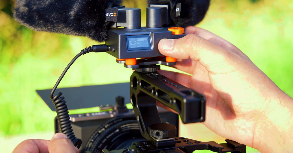 Camera Operator Using a Video Camera · Free Stock Photo