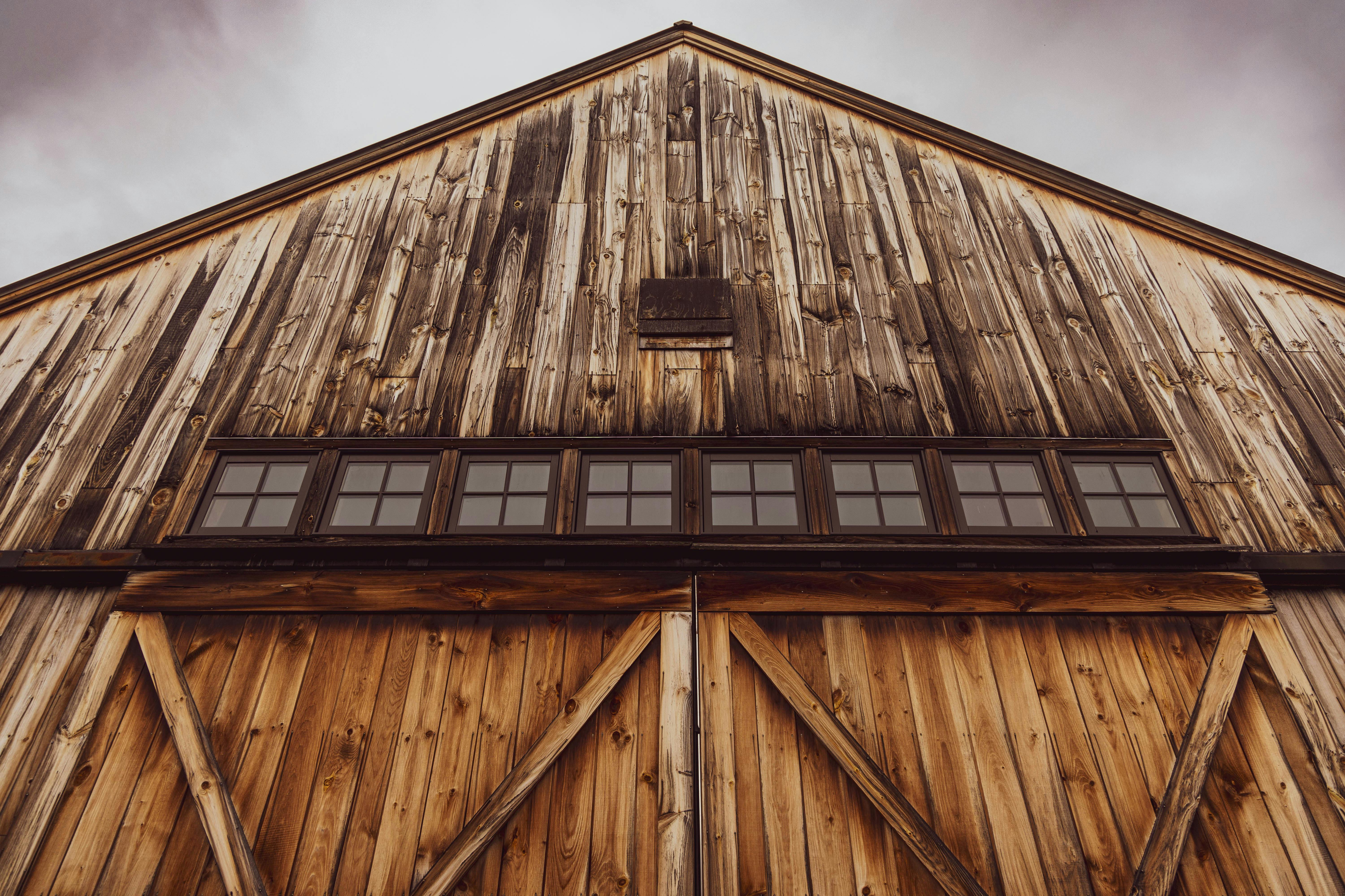 Castle Farm's grand timber frame barn with equestrian elements - Barn wedding venues Maryland