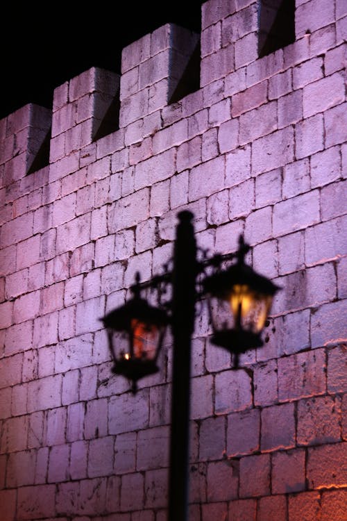 Light on Fortification Wall behind Street Lamp