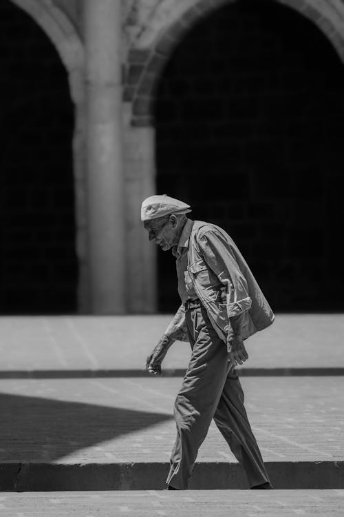 Elderly Man Walking in City