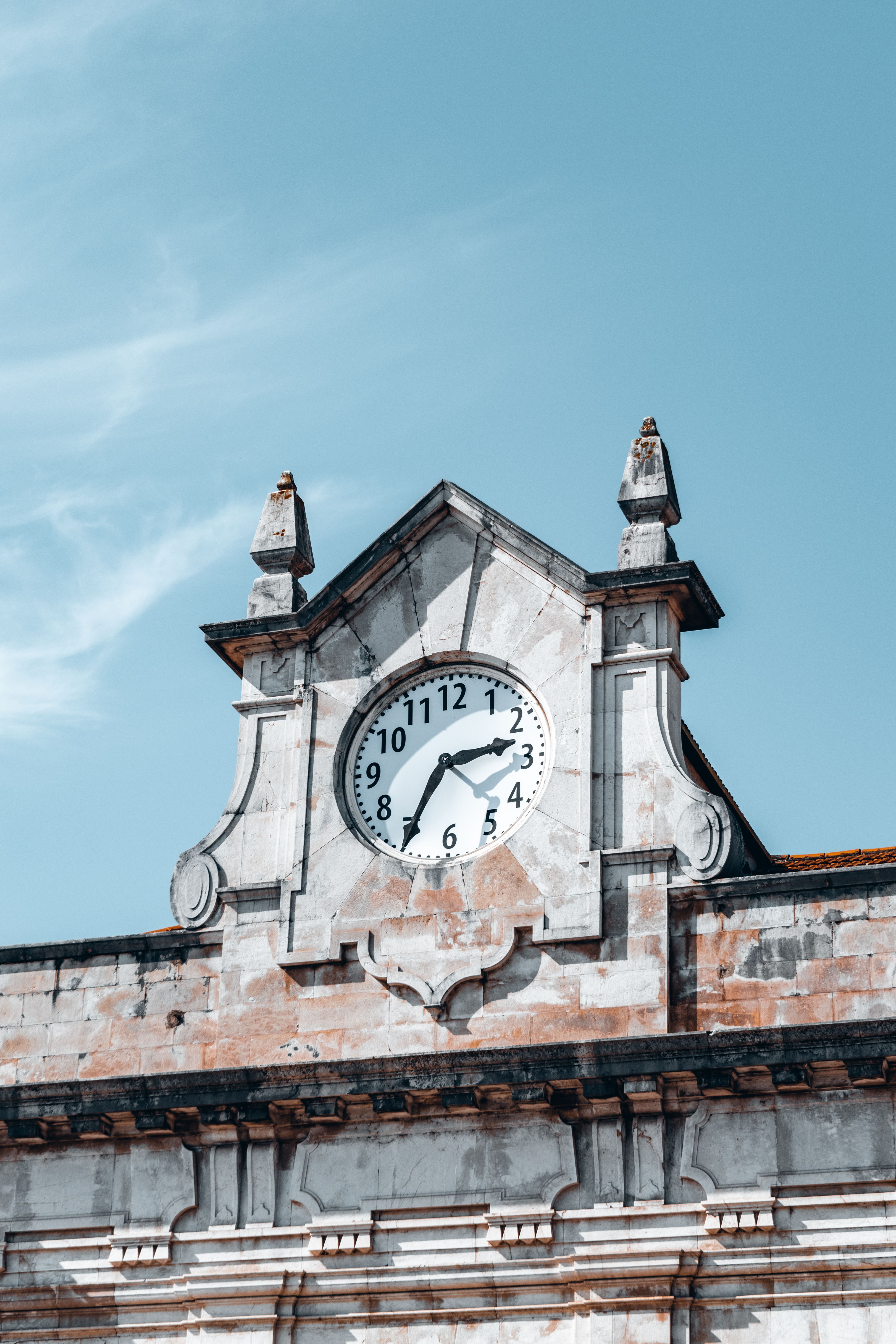 Clock on the Facade of a Historic Building · Free Stock Photo
