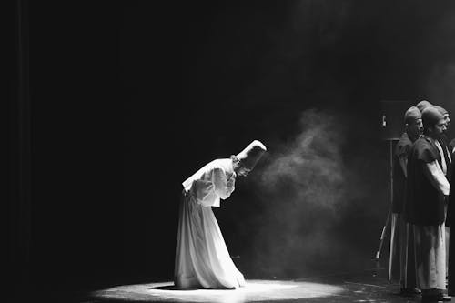 Dancer in White Gown on Stage
