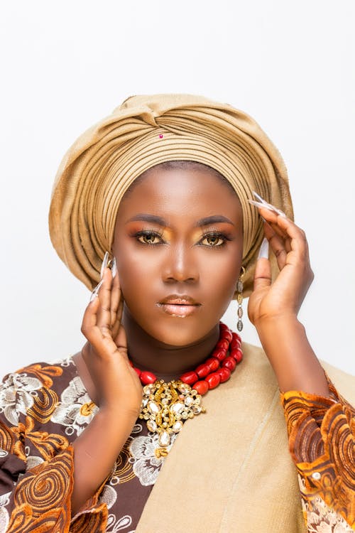 Portrait of a Young Woman Wearing a Turban and Glamour Makeup 