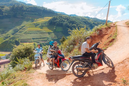 People on Motorcycles on a Country Road