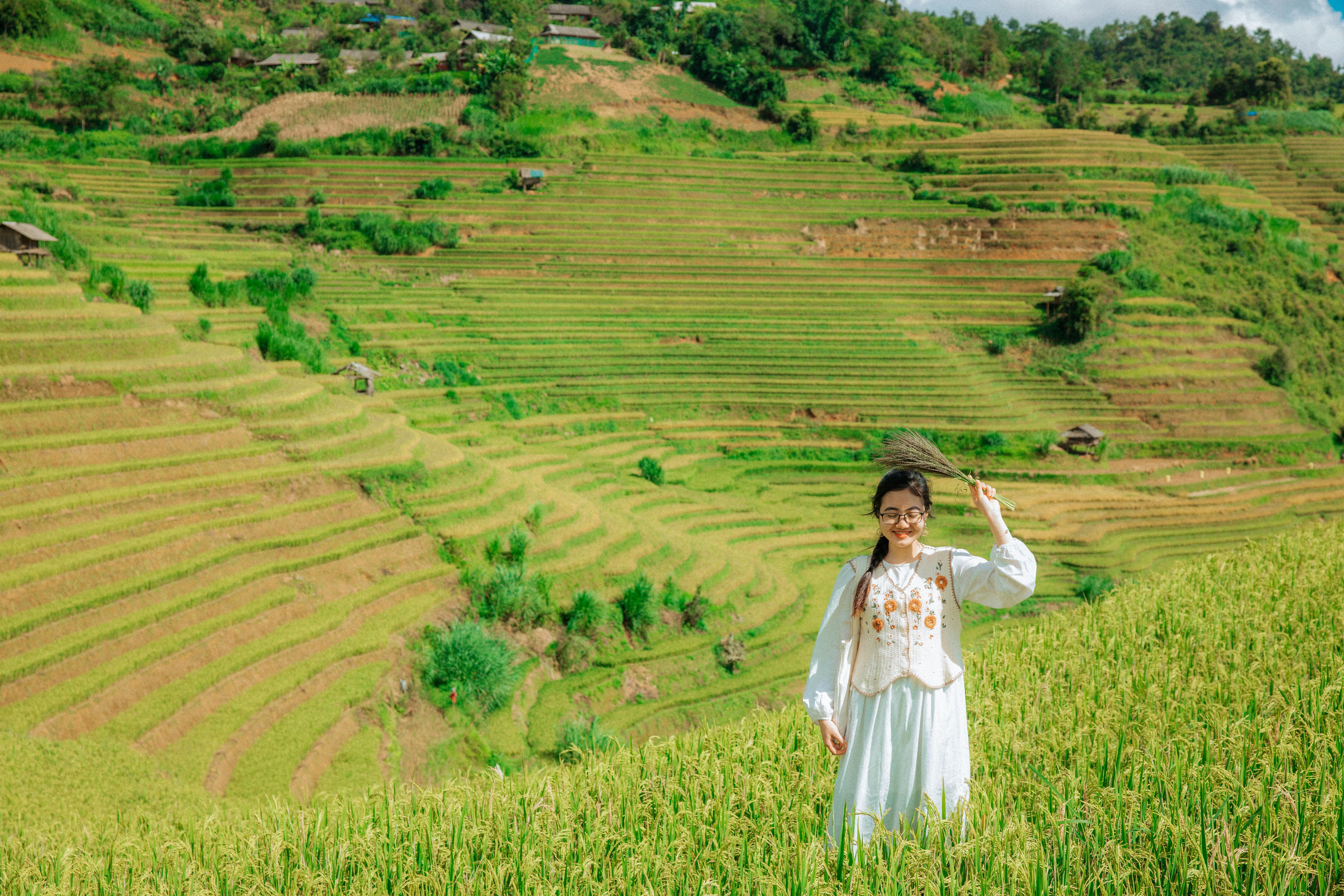 Woman in Traditional Dress Standing on Rural Fields in Village · Free ...