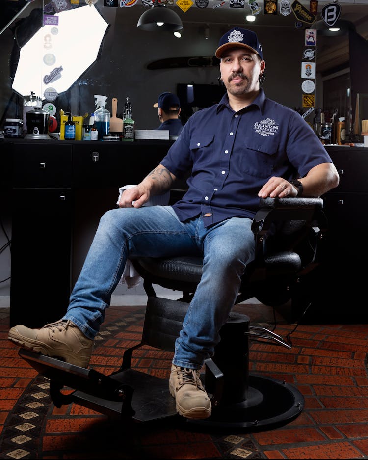 Hairdresser Sitting In A Hair Salon Chair